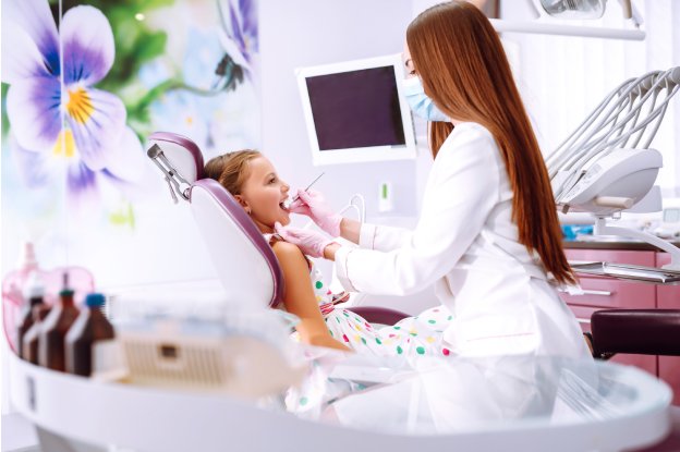 Child receiving a dental checkup at a kids dental clinic near me in Katy